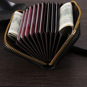 Short black woven pattern leather wallet with gold zipper and accordion card slots
