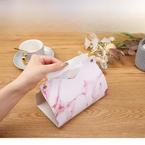 Macro view of marble pattern leather tissue box showing smooth paper dispensing feature