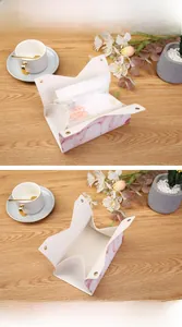 Detail view of marble pattern PU leather tissue box with elegant gold snap button closure