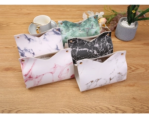 Detail showing five colors of marble patterned PU leather tissue boxes with metal buckles