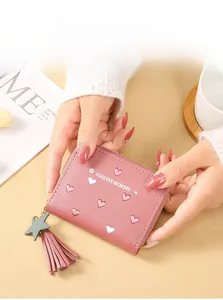 Pink PU leather wallet featuring heart embroidery and a star tassel charm detail