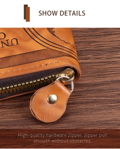Detail of premium gold metal zipper and vintage embossed texture on brown wallet