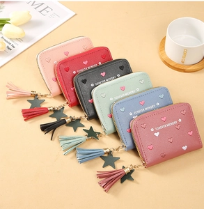 Detail of multi-color PU leather folding wallets with star charms and heart embroidery