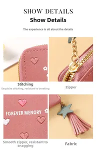 Close-up of pink PU leather wallet featuring floral embroidery and star tassel zipper
