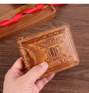 Macro view of vintage brown PU leather wallet featuring detailed $100 bill embossing
