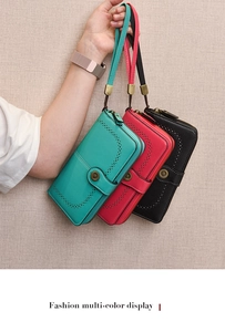 Detail of laser-cut pattern and sunflower metal buckle on long PU leather wallets