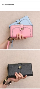Detail of long leather wallets with hollow pattern and sunflower metal buckle closures