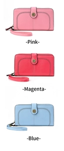 Detail of oil wax leather wallets in pink and blue with sunflower buckle and wristlet strap