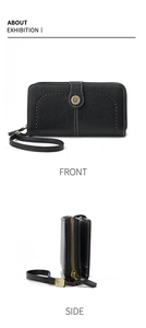 Detail of long black wallet with sunflower metal buckle, stitching and wrist strap