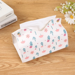 Floral PU leather tissue box cover with gold snaps in a cozy home setting decor