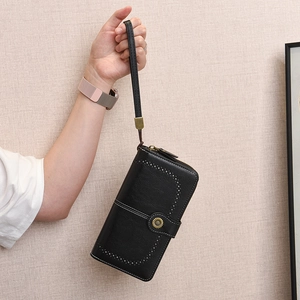 Long black wax leather wallet with decorative stitching, metal buckle and hand strap