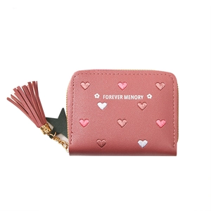 Short minimalist women's pink leather wallet with heart embroidery and tassel detail