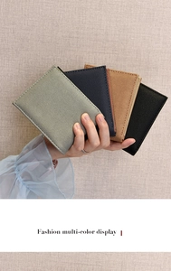 Detailed close-up of multi-color minimalist slim wallets in durable textured fabric