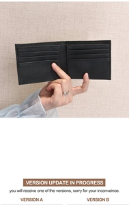 Detailed view of black bifold wallet showing multi-card slot interior and cross-grain leather