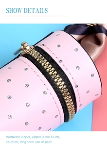 Detail of pink quilted coin purse with rhinestones and gold zipper hardware