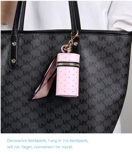 Pink cylinder mini coin purse charm with sparkling rhinestones and silk scarf detail
