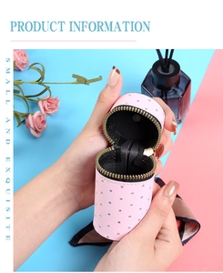Pink quilted bucket coin purse with rhinestones being opened for lipstick storage
