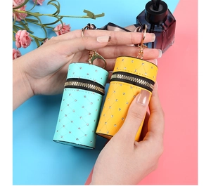 Close-up of mini bucket bags in blue and yellow with quilted patterns and crystals