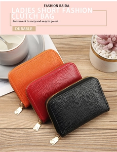 Three colors of durable PU leather zipper card wallets on a wooden desk with a coffee cup