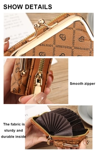 Detail of brown litchi pattern wallet with accordion card slots and kiss-lock closure