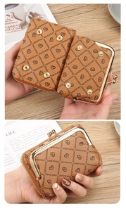 Detail view of brown PU leather wallet interior with card slots and metal clasp