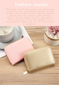 Detail of pink and gold PU leather card holders with lychee texture and metal zippers