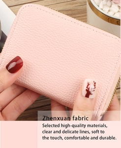 Close-up of pink litchi grain PU leather card holder with secure metal zipper closure