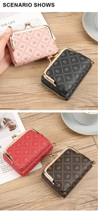 Detail of vintage heart-patterned coin purses with metal clasps on a wooden surface