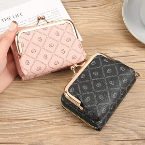 Fashionable mini zip coin purses in pink and black leather with embossed heart patterns