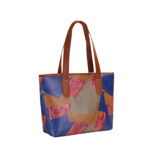 Retro patchwork faux leather tote bag with multi-color panel design and brown handles