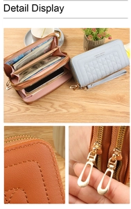 Detail view of double zipper long wallet showing embroidery stitch and card slots