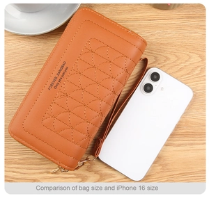 Quilted fan-patterned wristlet phone bag compared with iPhone for size reference
