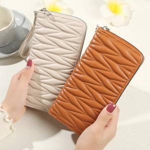 Quilted vegan leather zipper wallets for women with wrist straps in beige and brown
