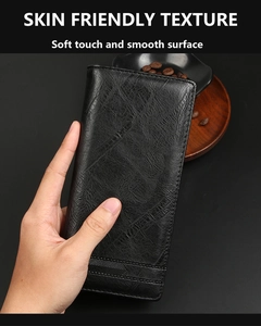 Macro shot of men's long wallet with soft skin friendly leather texture in black