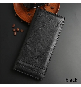 Close-up detail of black leather men long wallet with refined textured finish and thick structure