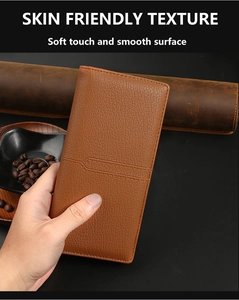 Close-up of brown long bifold wallet with soft skin-friendly lychee texture and stitching