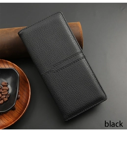 Close-up of long black pebble leather wallet with zipper on premium office background