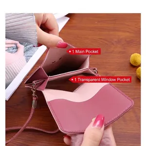 Pink crossbody phone bag with a transparent touch screen window and slim strap