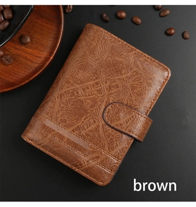 Detailed side view of vintage brown leather tri-fold wallet with secure snap fastener