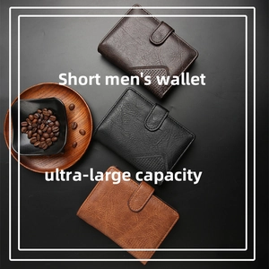 Detailed close-up of short men's leather wallets in multiple colors with buckle closures