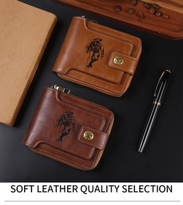 Detail of vintage men's wallet with embossed cowboy design and metal star studs