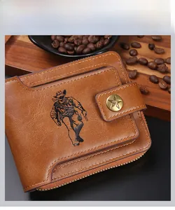Detailed view of brown leather wallet with cowboy embossed pattern and star buckle