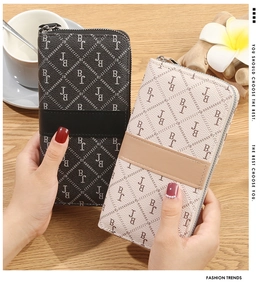 Close-up of long zip wallets in black and beige with BJ monogram pattern
