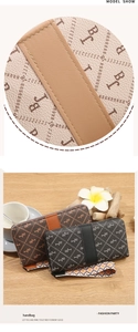Detailed macro view of litchi grain leather texture and monogram pattern on long wallets