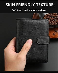Close-up of black leather men wallet with litchi texture and embossed deer head logo