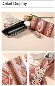Detail display of bohemian long wallet with geometric print and wristlet strap