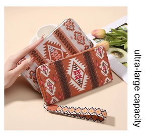 Bohemian long zipper wallet with ethnic geometric patterns and wrist strap detail