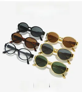 Detailed flat lay of oval vintage sunglasses in various frame colors and tinted lenses