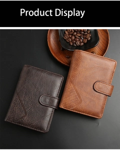 Detail of vintage men's short leather wallets with buckle and triangle punched design