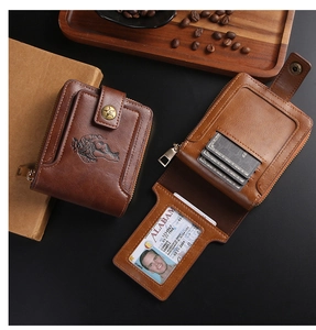 Detail of vintage brown leather wallet with bull embossing and zipper closure